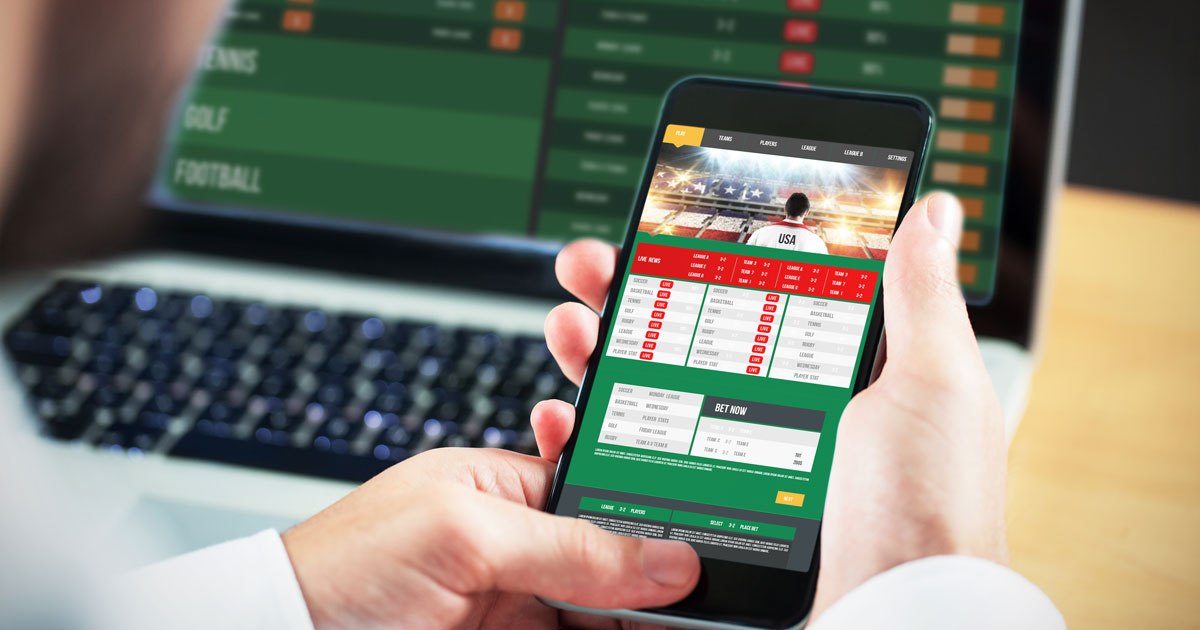 DraftKings logo pe un ecran de telefon