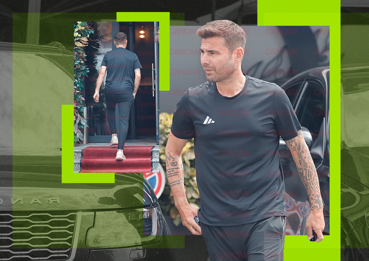 Adrian Mutu îmbrăcat în trening Adidas negru, pășind pe covor roșu la un restaurant din București